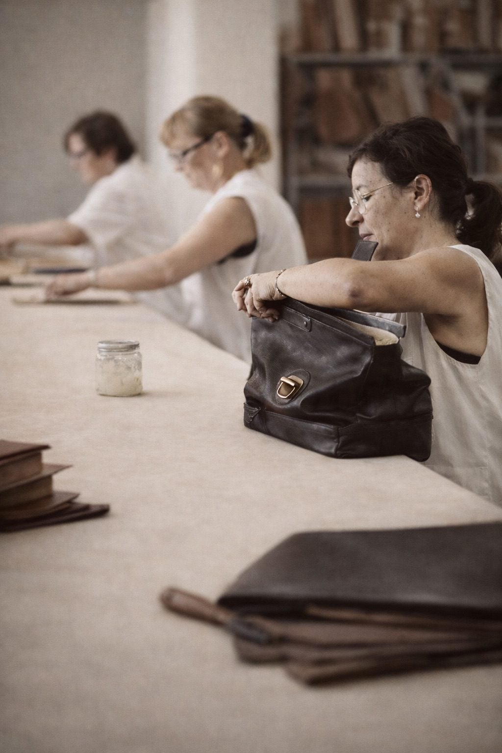 italian leather artisans finishing leather bag