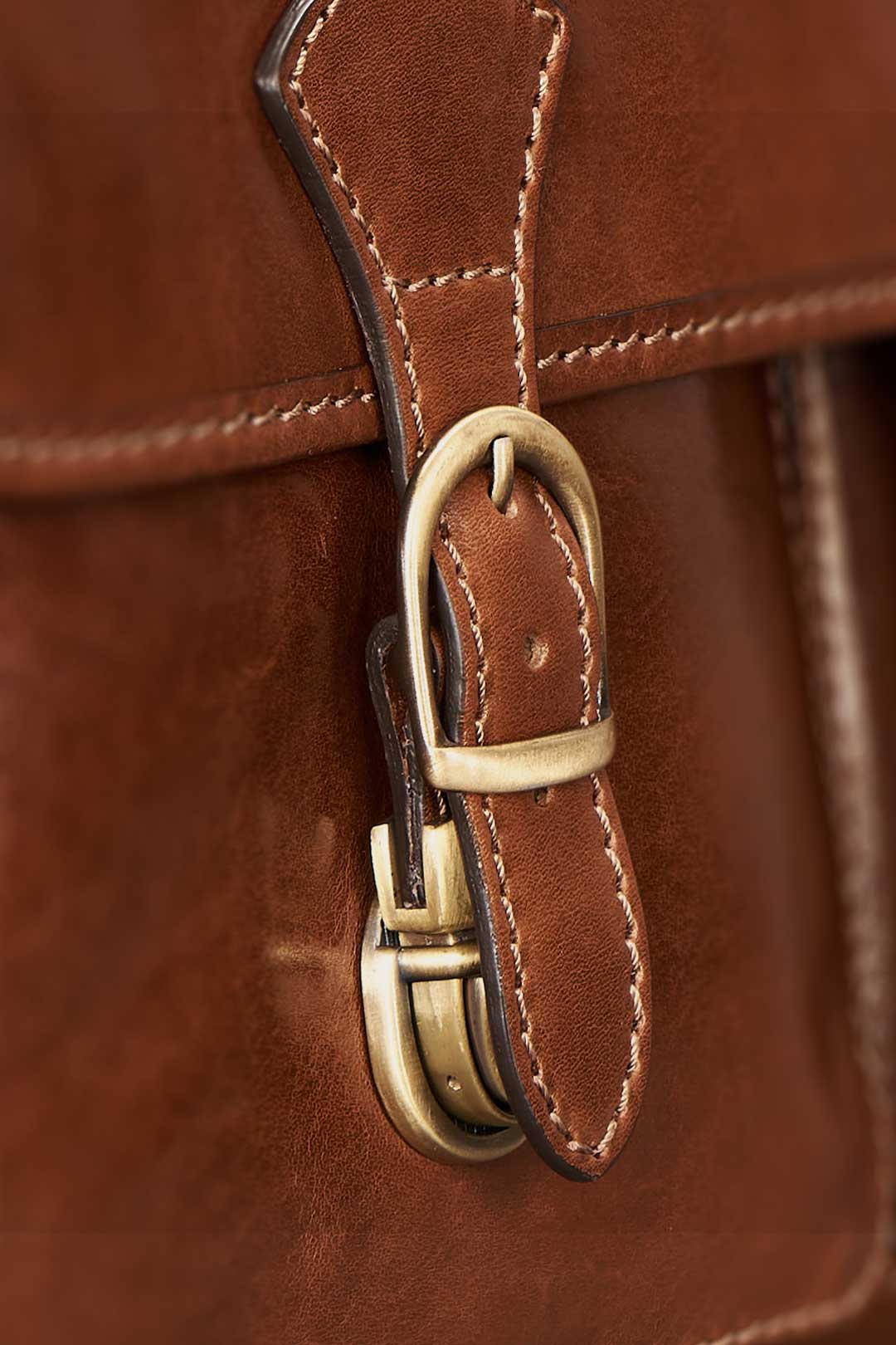 Leather macbook satchel buckle detail with hidden clasp design