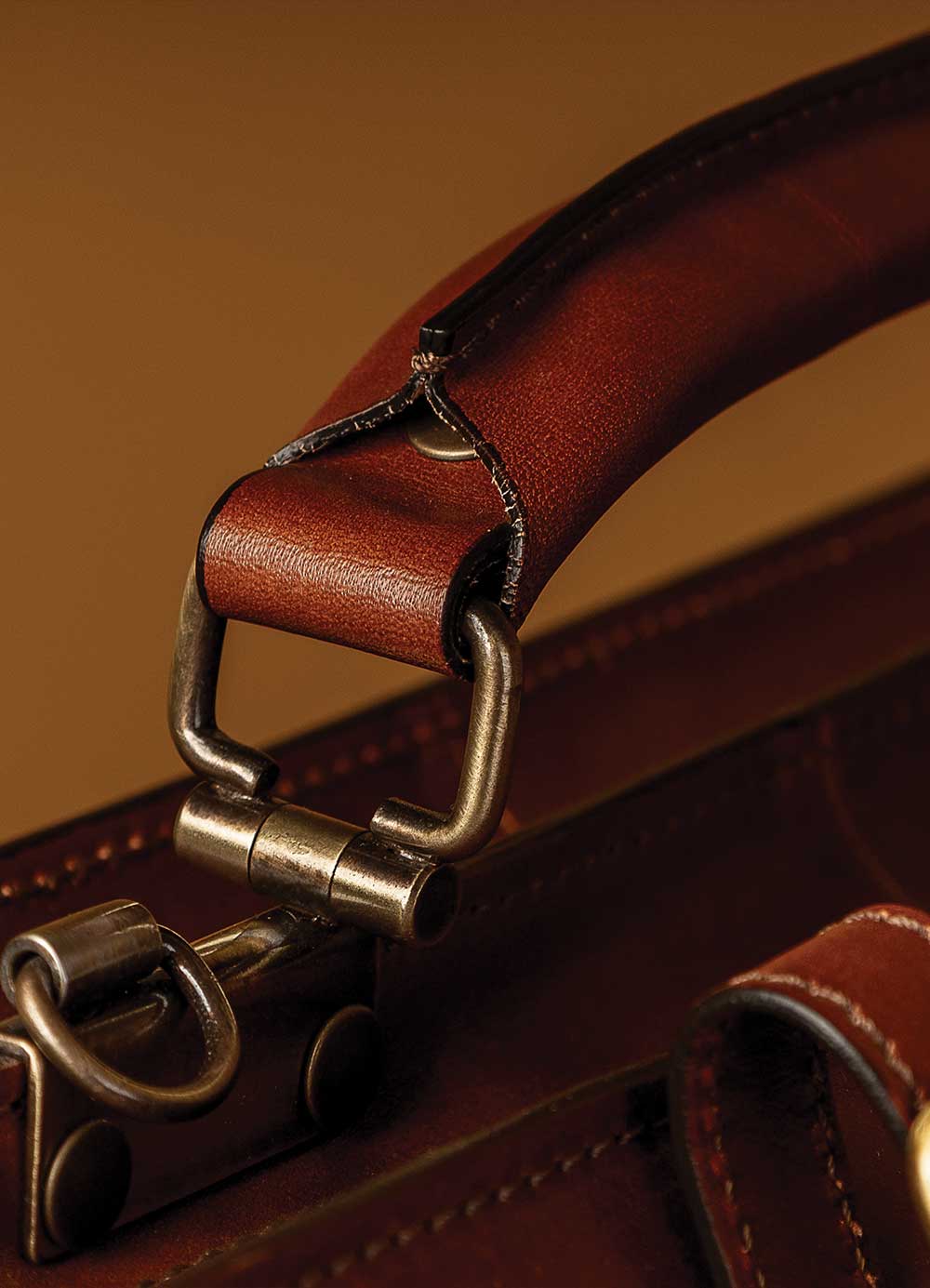 Handcrafted leather briefcase Italy comfort grip handle detail