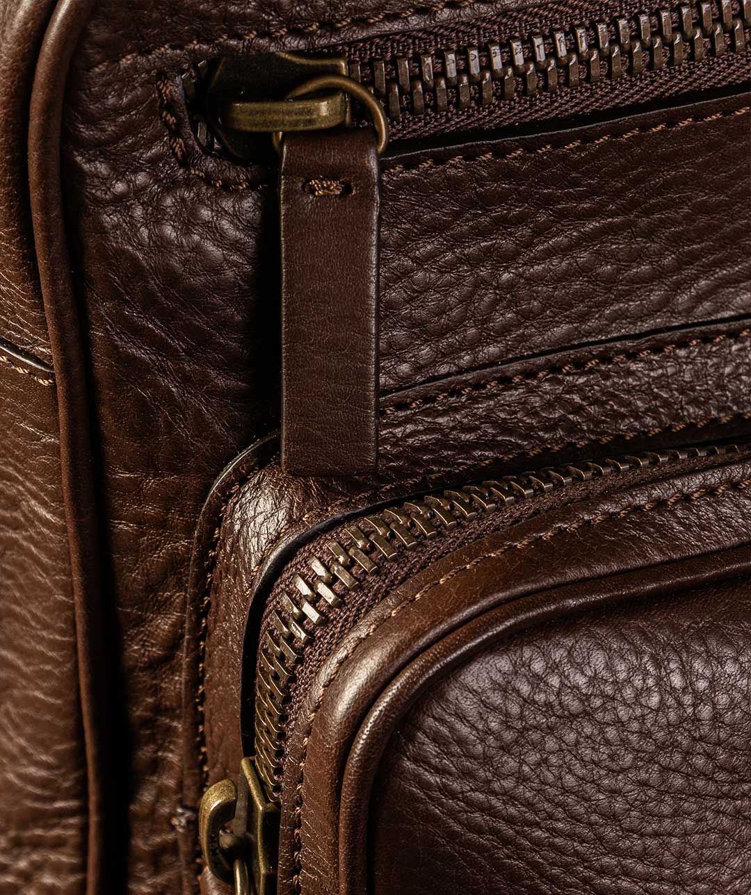 Premium YKK metal zips on luxury leather business travel backpack