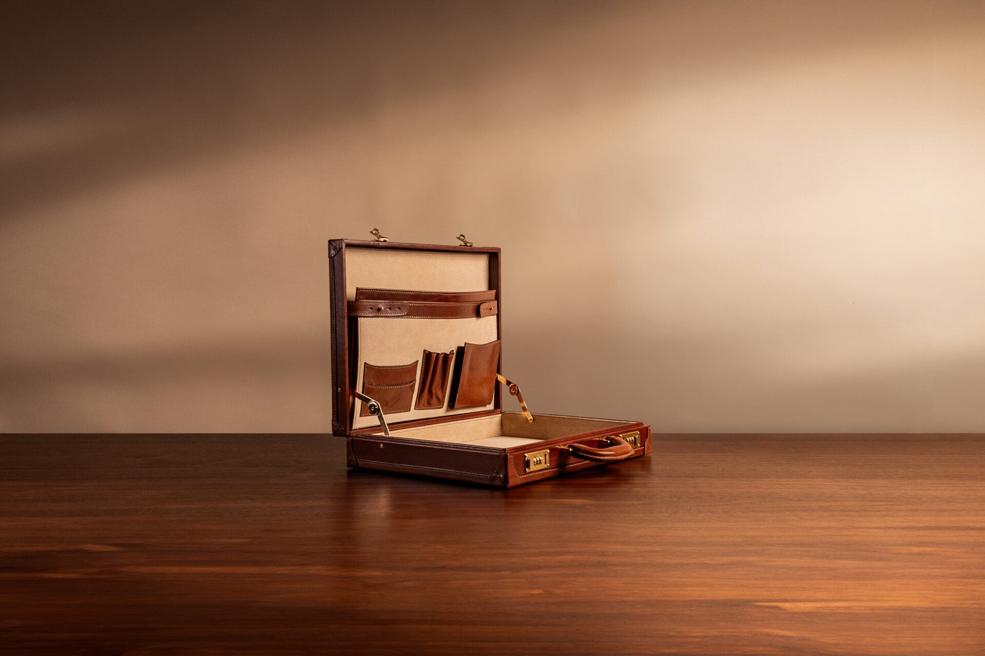 Structured leather attaché case with box-frame construction